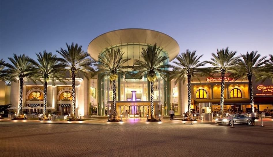 Evening exterior shot of entrance to The Mall at Millenia. Orlando, Florida.