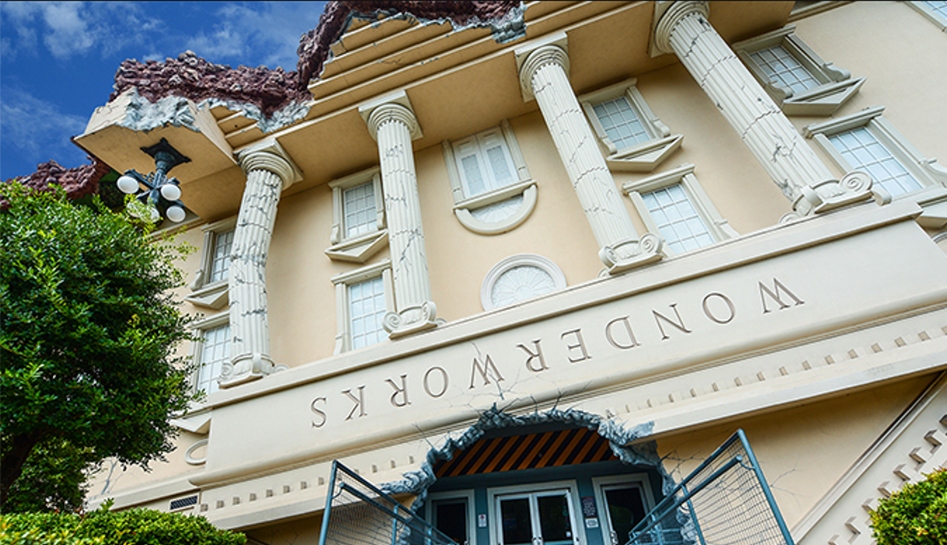 Daytime photo of the front of the Wonderworks museum (close-up looking upward) in Orlando, Florida.