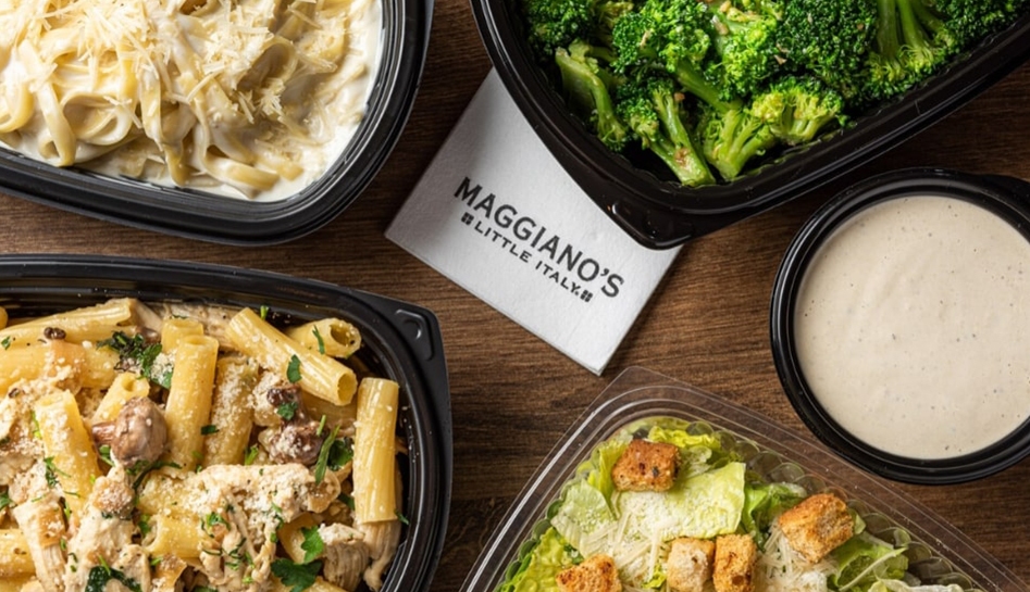 A variety of dishes including chicken pasta, salad, broccoli, and others with a 