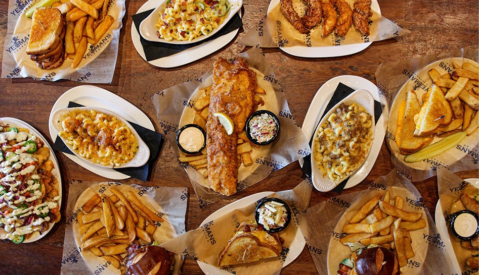 A spread of various entrees from Yeoman's Cask & Lion at Sunset Walk. Kissimmee, Florida.