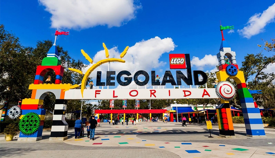 Daytime photo of front entrance to Legoland Florida, guests walking into the theme park. Winter Haven, Florida.
